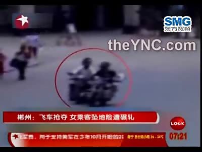 Violent Purse Snatcher pulls Female right off a Motorcycle on the Street