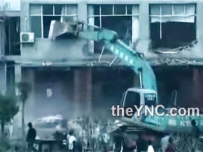 Female Protesting the Demolition of Building decides to jump off the Roof