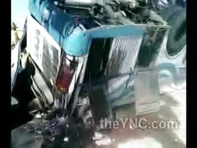 Dead Guys on Flipped over Bus Lie in Pool of Blood and Oil