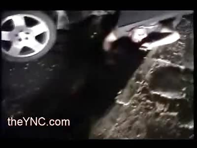 And the Beat goes On..Drunk Man Dangling from his Car still has his Radio On