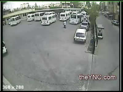 Oblivious Man standing behind a Bus gets Run Over