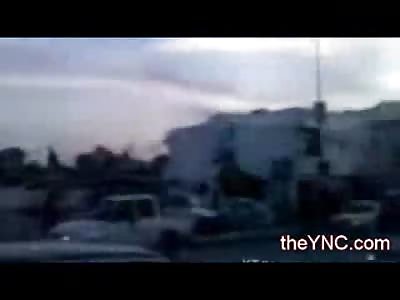 Gaddafi from the Grave...Man with New Flag of Libya Sniped in public by Gaddafi Soldier 