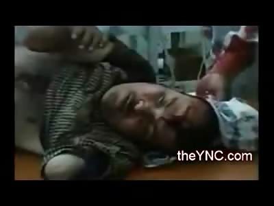 Handicap Man with No Arms Dying from Direct Bullet to the Head