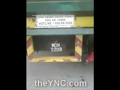 WOW: Motorcyclist Ends up Tangled under Trucks Wheel......Ouch!