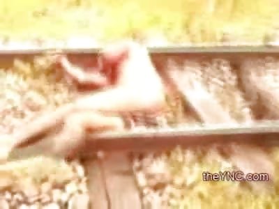 FULL Video: Naked Squirming Man Still Alive after Attempted Suicide by Train