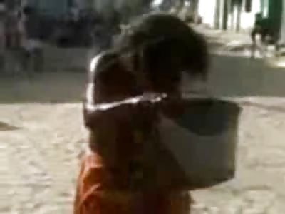 Dirty Girl takes a Bath in Street Water