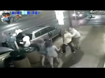 Black Kid with Brass Knuckles Knocks out a Couple Guys and starts Massive Brawl on the Street