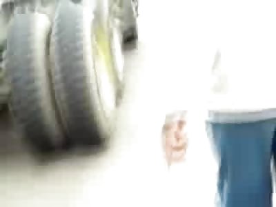 Unhappy Female Biker with Scowl on his Face Decapitated the rest of his Body under the Truck