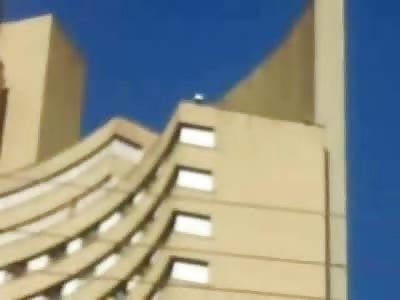 Woman jumps to her Death from Building and Splats on the Street as others Egg Her On