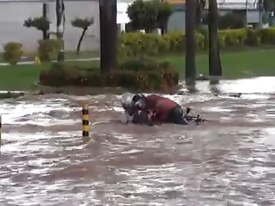 Motorcycle Couple hit a Little Pot Hole