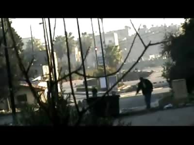 Man sweeping the Floor moves out of the Way for an RPG Terrorist