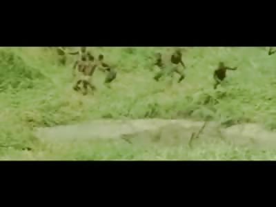 Hungry Species of African Human Beings Hunt Down and Kill a Hippo with their Primitive Spear Weaponry 