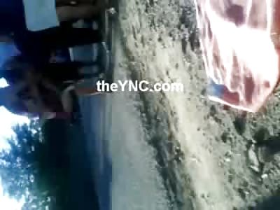 Hysterical Family lifts Blanket off of Dead Man to see his Blown Off Jaw