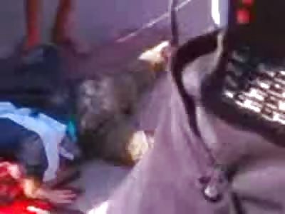 Schoolboy lies in his own Guts as Onlookers get out their Cell Phone