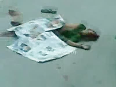 Woman Crying Her Eyes out in Hysteria Looking at her Dead Mangled Man