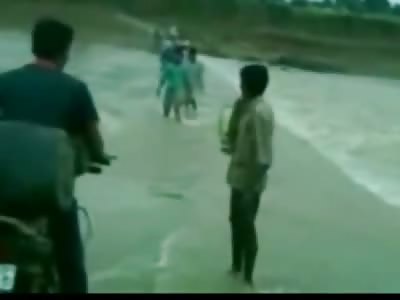 One Saved One Washed Away to Their Death