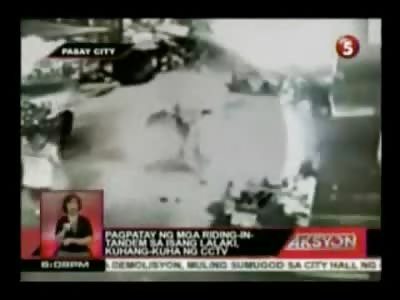 Man lying on his Stomach is Brutally Executed on the Street with Rifle and Handgun