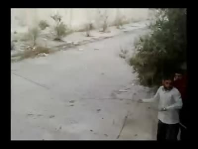 Girl with a Lot of Guts gets a Body out of Street from a Sniper 