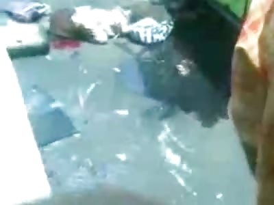 TEAM EFFORT: Entire Crowd Lifts Bus off Old Woman.