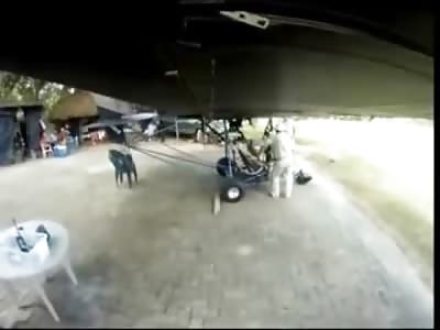 Man Not Paying Attention walks into a Moving Propeller slicing up his Shoulder