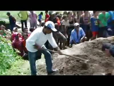 Man quartered is Dug up Piece by Piece in Front of Town