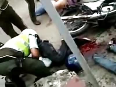 Man in Pure Agony Rolls around on the Street Spewing Blood Everywhere