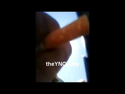 Civilian is Executed in the Street with a Hand Gun Shot to the Head ..Casual Cameraman Smoking a Cigarette 