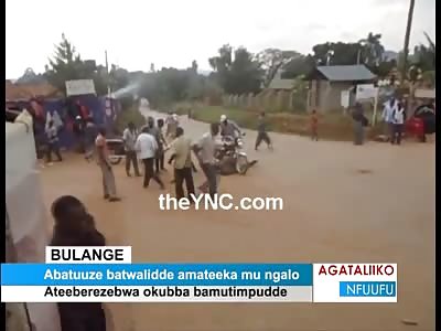 The Peoples Court...African Mob whips a Guys Ass anyway they can..Motorcycle, Stones, Fists