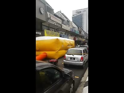 Man Rolls to his Death off of Roof Building onto the Street