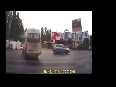 White Car Goes Bowling for Pedestrians on the Sidewalk