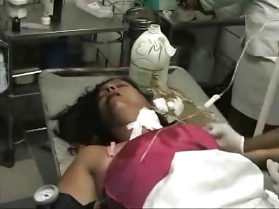 Woman with Stab Wound to the Neck in a World of Hell on the Hospital Bed