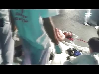 Nurses in White Coats Examine Man that is Obviously Dead in the Street