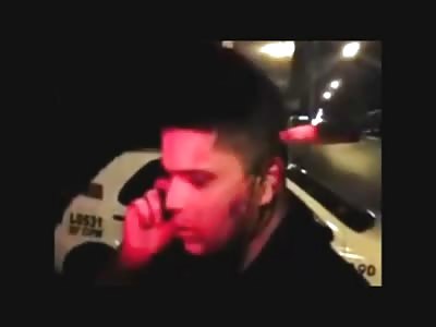 Just a Man making a Phone Call with a Knife Stuck in his Head