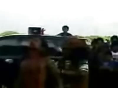 Man with Knife Through is Neck is Paraded around Crowd