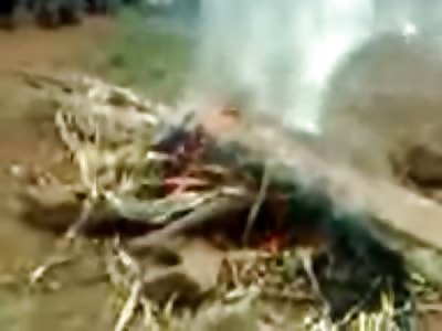 Crowd Watches Man Burn Alive Squirming in the Fire