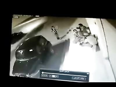 Activist Group Huddled together on the Sidewalk are Confronted, One if Executed with AK-47 Rifle and Killed on the Spot