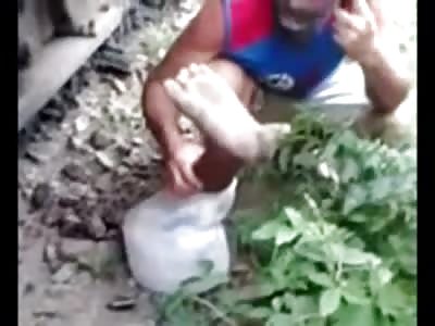 Man on Cell Phone tries to Comfort man while Holding his Leg..Still Alive (He later Died) 