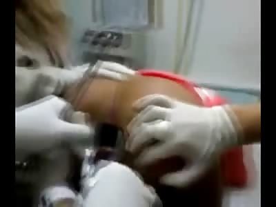 Well..you asked for it..Here's a Dildo being removed from a Woman's Ass who went Way too Deep