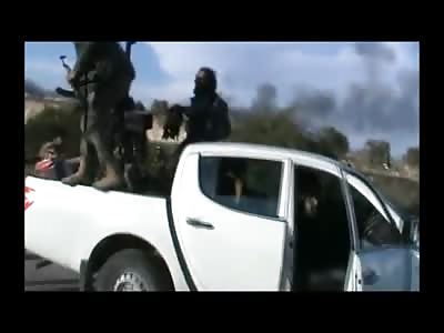 Terrorist shows Off Trophy to Show Off after Ambush on Truck