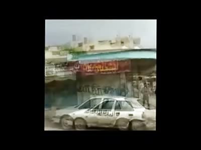 Man Tied to Pole and Blindfolded in the Middle of the Street before Executed by Rapid Machine Gun Fire