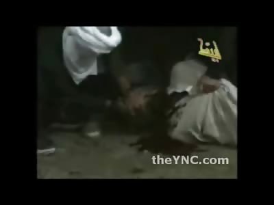 Slow Beheading with Small Knife of a Man with a Rag stuffed in his Mouth