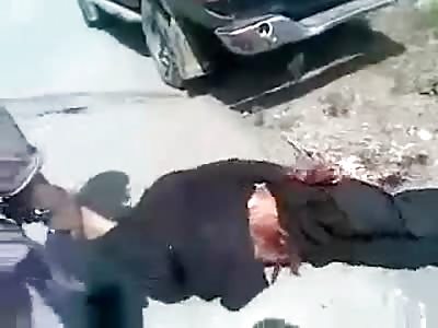 This Guy has the Very Cushy Job of Laying out Beheaded Bodies on the Street for Infidels to See