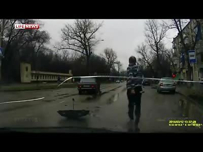 9 Year Old Umbrella Boy is Hit by Car and ends up underneath the Vehicle to the Horror of Onlookers
