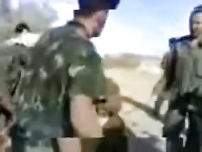 Very Bizarre Torture Ritual ... Soldiers are Forced to Make out with Dead Wolf and Eat it