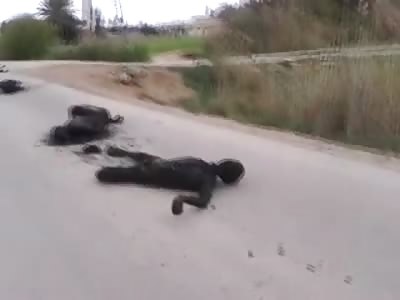 Charred Bodies Line the Streets in Bizarre Scene