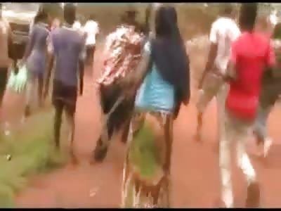 Africans Murder Man by having a Bonfire with him Still Alive