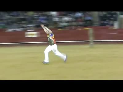 Slow Motion Video of Idiot Running at a Bull with Flaming Horns 