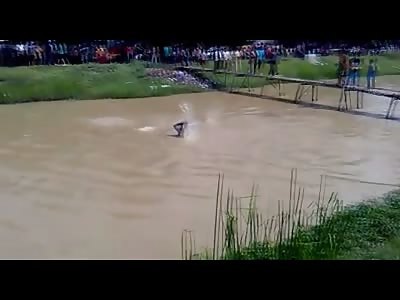 Nowhere to Run: Man Being Savagely Stoned From Almost Every Direction While in a Murky River Water