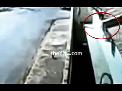 Bicyclist hit so Hard his Bike ends up on the Rooftop