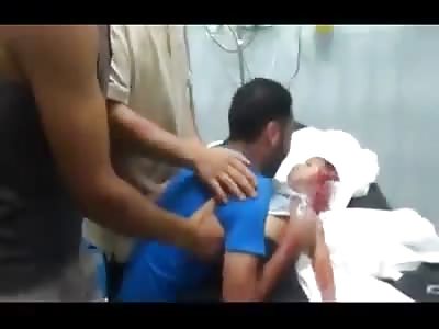 Father of 4 Year Old Begs his Son to Wake Up to see the Toy he Bought for Him (Video is Very Sad, from Palestine).